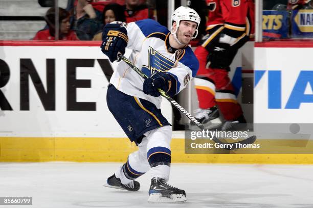 Barret Jackman of the St. Louis Blues passes the puck against the Calgary Flames on March 20, 2009 at Pengrowth Saddledome in Calgary, Alberta,...