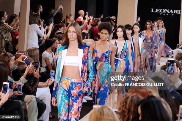 Models present creations for Leonard Paris during the women's 2018 Spring/Summer ready-to-wear collection fashion show in Paris, on October 2, 2017.