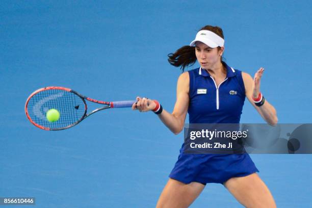 Christina McHale of the United States returns a shot against Sloane Stephens of the United States during the women's singles first round on day three...