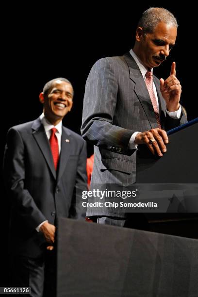 President Barack Obama laughs as U.S. Attorney General Eric Holder jokes about his basketball skills during his ceremonial installation at George...