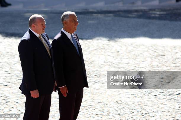 Portugal's President Marcelo Rebelo de Sousa and Georgia's President Giorgi Margvelashvili listens to the national anthems at the Belem Palace in...