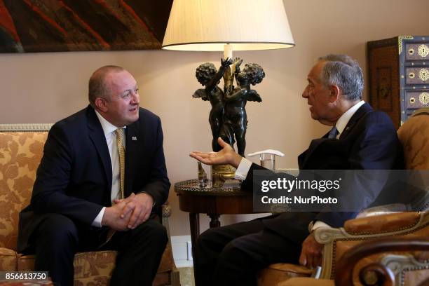 Portugal's President Marcelo Rebelo de Sousa chats with Georgia's President Giorgi Margvelashvili at the Belem Palace in Lisbon, on October 2 during...