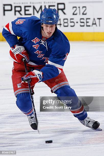 Marc Staal of the New York Rangers controls the puck against the Minnesota Wild on March 24, 2009 at Madison Square Garden in New York City. The...