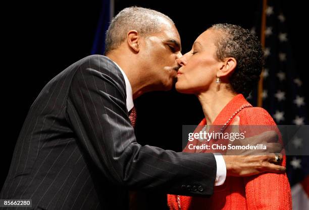 Attorney General Eric Holder kisses his wife Dr. Sharon Malone during his ceremonial installation at George Washington University March 27, 2009 in...