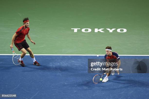 Diego Schwartzman of Argentina plays a forehand with doubles partner Dominic Thiem of Austria against Yuichi Sugita of Japan and Toshihide Matsui of...