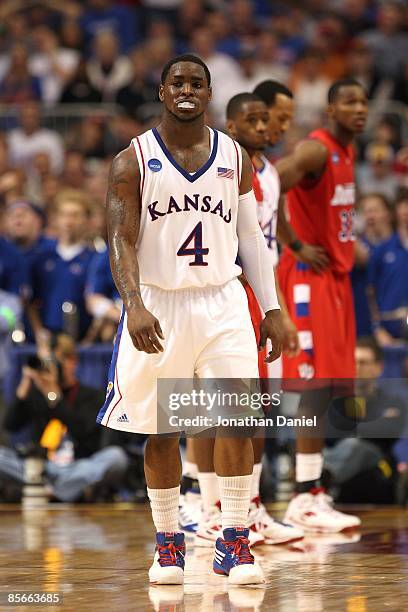 Sherron Collins of the Kansas Jayhawks walks on court against the Dayton Flyers during the second round of the NCAA Division I Men's Basketball...