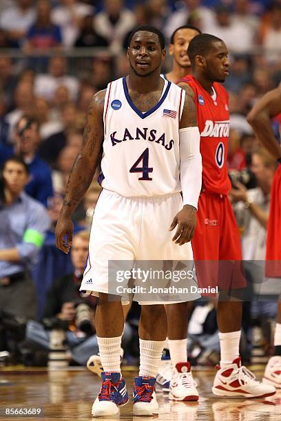 Sherron Collins of the Kansas Jayhawks walks on the court against the Dayton Flyers during the second round of the NCAA Division I Men's Basketball...