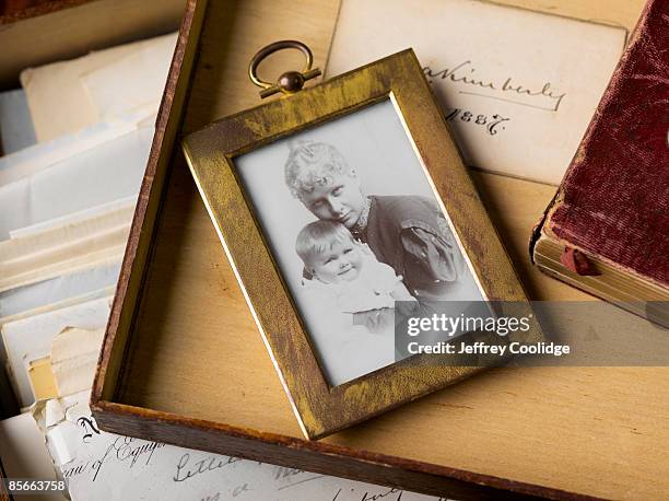 antique photo of mother and child - memories box stock pictures, royalty-free photos & images