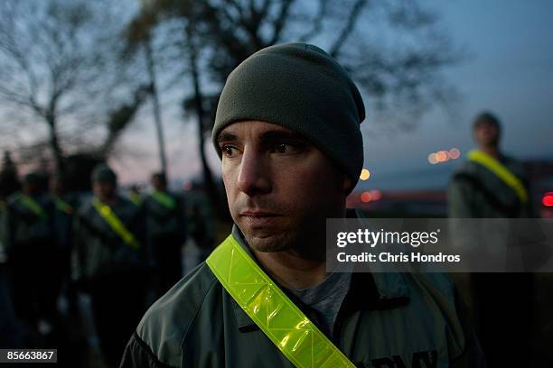 Army Sgt. First Class James Latella of the New York Recruiting Battalion stands for pre-dawn PT exercise at Fort Hamilton, New York City's only...