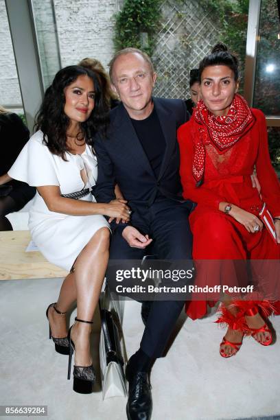 Of Kering Group, Francois-Henri Pinault sitting between his wife actress Salma Hayek and Giovanna Battaglia attend the Giambattista Valli show as...