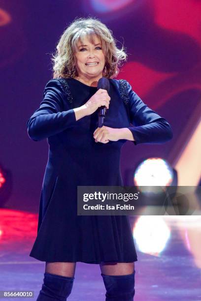 Norwegian singer Wencke Myhre performs during the tv show 'Willkommen bei Carmen Nebel' at TUI Arena on September 30, 2017 in Hanover, Germany.