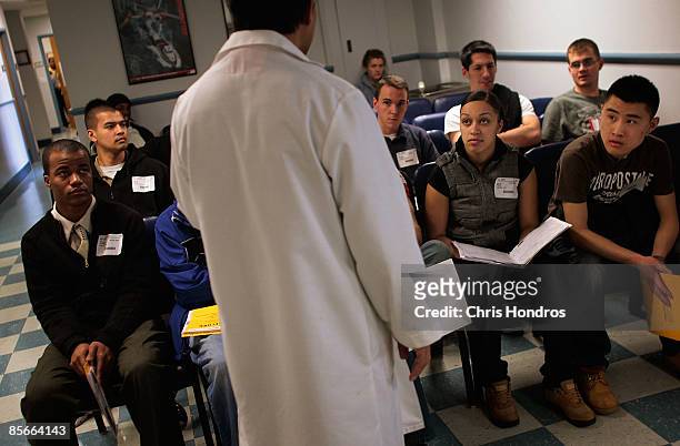 New military recruits listen to a doctor before having obligatory medical tests done at Fort Hamilton, New York City's only active-duty military...