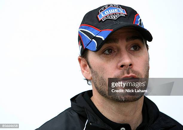 Jimmie Johnson, driver of the Lowe's Chevrolet, stands in the garage area during practice for the NASCAR Sprint Cup Series Goody�s Fast Pain Relief...