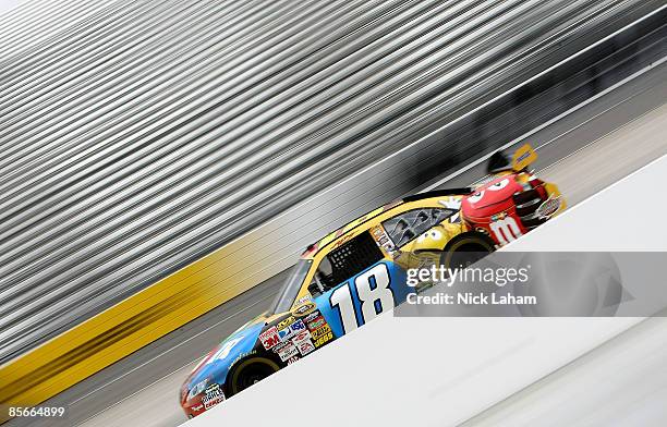 Kyle Busch, driver of the M&M's Toyota drives during practice for the NASCAR Sprint Cup Series Goody�s Fast Pain Relief 500 at the Martinsville...