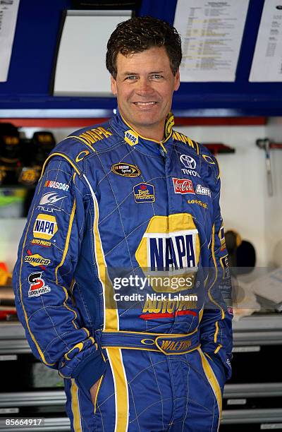 Michael Waltrip, driver of the NAPA Auto Parts Toyota stands in the garage during practice for the NASCAR Sprint Cup Series Goody�s Fast Pain Relief...