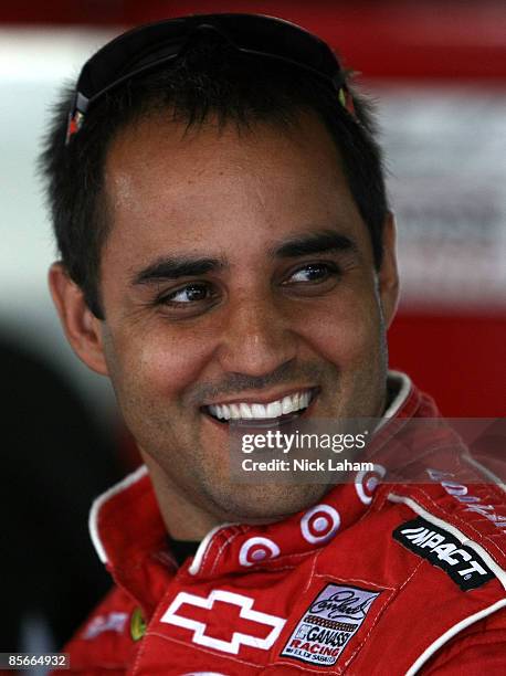 Juan Pablo Montoya, driver of the Target Toyota talks in the garage during practice for the NASCAR Sprint Cup Series Goody�s Fast Pain Relief 500 at...