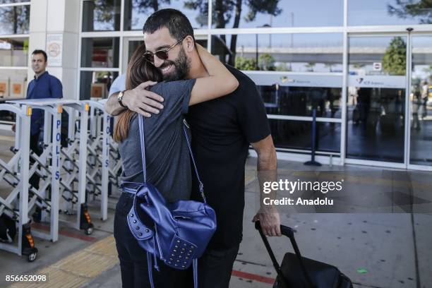 Arda Turan of Turkey hugs a woman as he arrives in Antalya with Turkish National Football Team ahead of the 2018 FIFA World Cup qualification Group I...