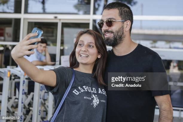 Arda Turan of Turkey poses for a photo with a woman after he arrives in Antalya with Turkish National Football Team ahead of the 2018 FIFA World Cup...
