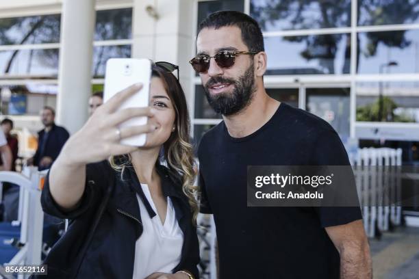 Arda Turan of Turkey poses for a photo with a woman after he arrives in Antalya with Turkish National Football Team ahead of the 2018 FIFA World Cup...