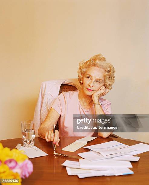 woman with bills - letter opener stock pictures, royalty-free photos & images