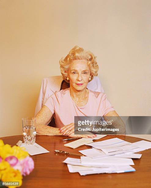 woman with bills - letter opener stock pictures, royalty-free photos & images