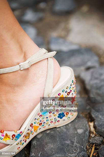 foot wearing sandal with jewels - rhinestone stock pictures, royalty-free photos & images