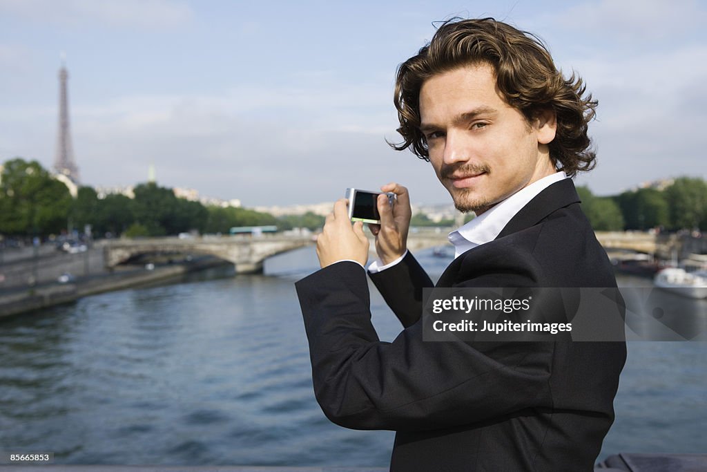 Man taking a picture , River Seine , Paris , France