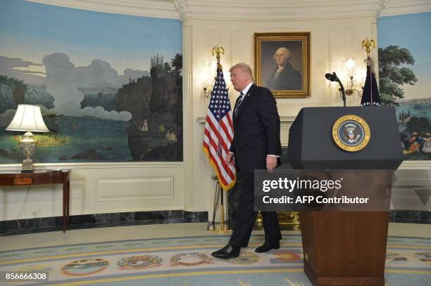 President Donald Trump leaves after delivering a statement on the Las Vegas shooting from the Diplomatic Reception Room of the White House on October...