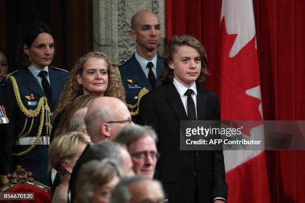 The Designate Governor general Julie Payette and her son Laurier Payette Flynn stand in the Senate in Ottawa, Ontario, October 2, 2017. Former...