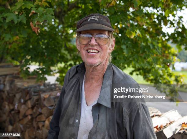 Robert Marble stacks firewood on his converted dairy farm in Charlotte, Vermont, September 26, 2017. Marble is a firewood supplier who has cut and...