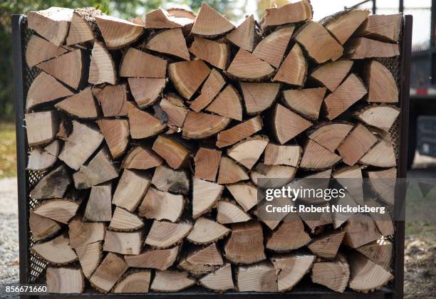 Robert Marble stacks firewood on his converted dairy farm in Charlotte, Vermont, September 26, 2017. Marble is a firewood supplier who has cut and...