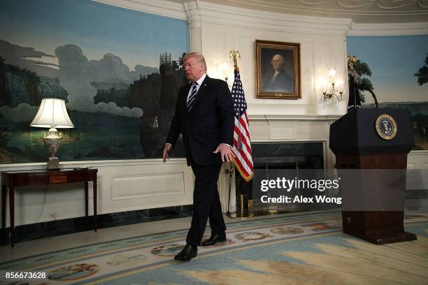 President Donald Trump leaves after making a statement on the Las Vegas mass shooting at the Diplomatic Room of the White House October 2, 2017 in...