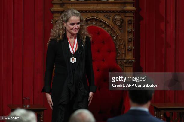 The 29th Governor general Julie Payette acknowledges the appaluse in the Senate in Ottawa, Ontario, October 2, 2017. / AFP PHOTO / Lars Hagberg