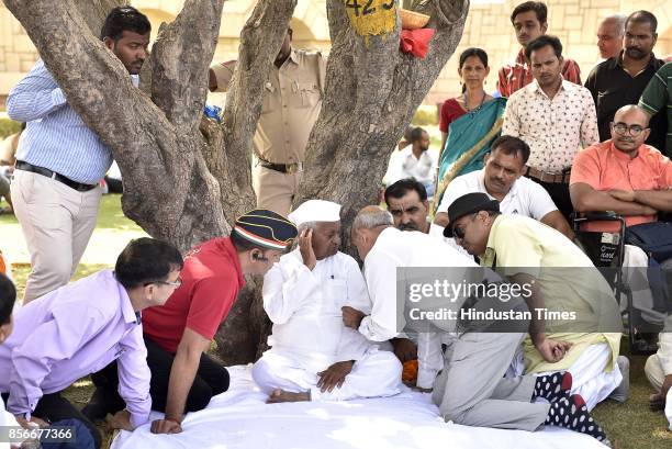 Social activist Anna Hazare sits on a day-long hunger strike for implementation of the Lokpal Bill, protesting against the Modi government for "doing...