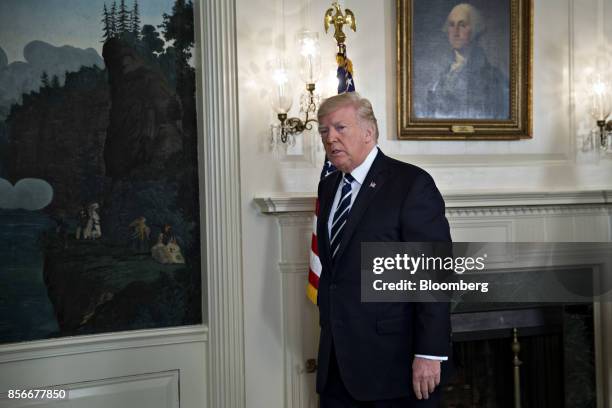 President Donald Trump exits after delivering remarks on the Las Vegas mass shooting in the Diplomatic Room of the White House in Washington, D.C.,...