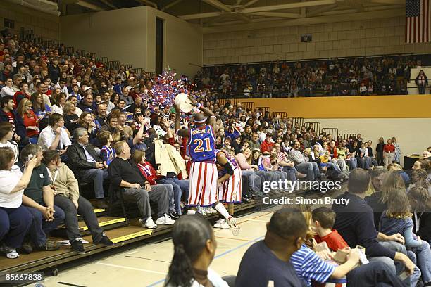 Harlem Globetrotters Special K Daley throwing confetti at fans during game vs Washington Generals at Towson Arena. Towson, MD 3/15/2009 CREDIT: Simon...