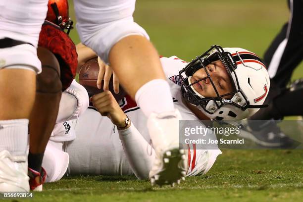 Daniel Santacaterina of the Northern Illinois Huskies is tackled in the third quarter during the Northern Illinois v San Diego State game at Qualcomm...