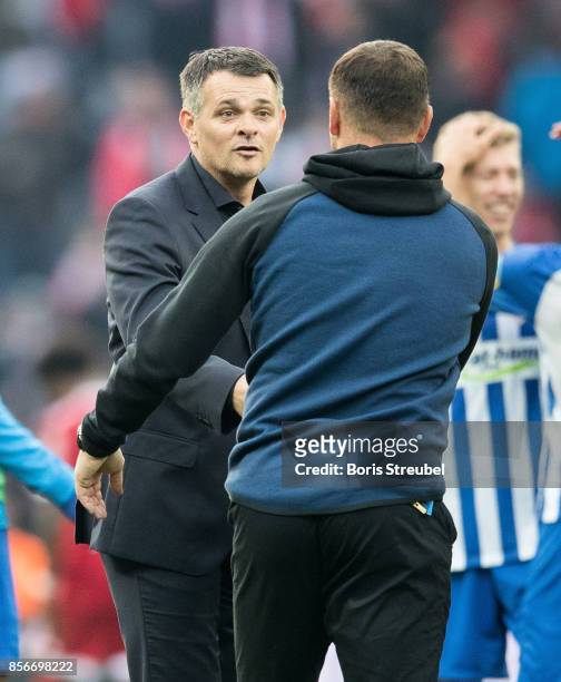 Head coach Willy Sagnol of FC Bayern Muenchen shake hands with head coach Pal Dardai of Hertha BSC after the Bundesliga match between Hertha BSC and...