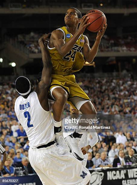 Guard Kim English of the Missouri Tigers drives to the hoop against the Memphis Tigers in the Sweet 16 of the NCAA Division I Men's Basketball...