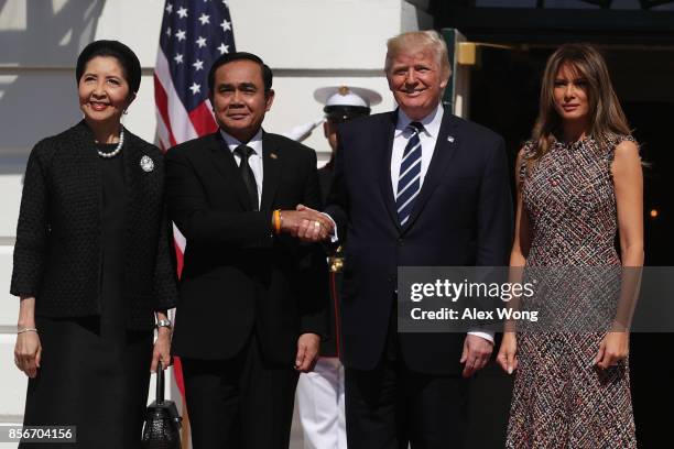 President Donald Trump and first lady Melania Trump welcome Thai Prime Minister Prayut Chan-o-cha and his wife Naraporn Chan-o-cha during an arrival...