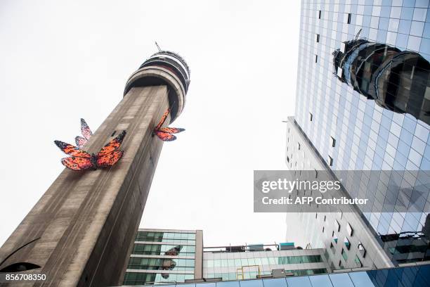 View of five giant butterflies that stand on the shaft of the Entel Tower--a symbol of modernity, communications and concrete of the city--is the...