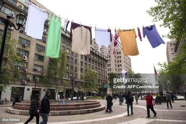 Giant clothing line hanging across the Paseo Bulnes promenads is the installation by Australians "The Glue Society", as part of "Hecho en Casa Fest"...