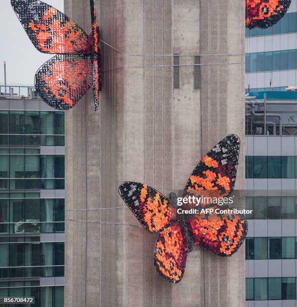 View of five giant butterflies that stand on the shaft of the Entel Tower--a symbol of modernity, communications and concrete of the city--is the...