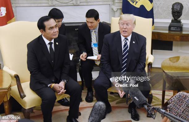 President Donald Trump meets with Prime Minister Prayut Chan-o-cha of Thailand in the Oval Office of the White House October 2, 2017 in Washington,...