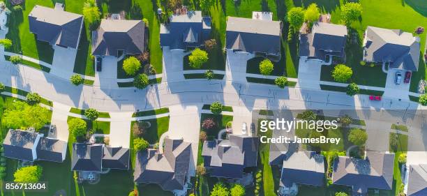 idyllic neighborhood street, aerial view - show home stock pictures, royalty-free photos & images