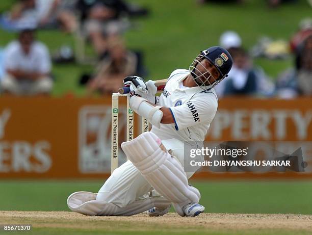 Indian cricketer Sachin Tendulkar ducks during the third day of the second Test match at the McLean Park in Napier on March 28, 2009. In reply to New...