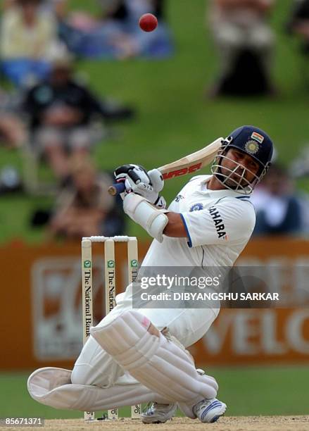 Indian cricketer Sachin Tendulkar ducks during the third day of the second Test match at the McLean Park in Napier on March 28, 2009. In reply to New...