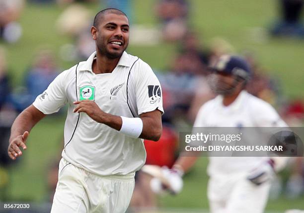 New Zealand cricketer Jeetan Patel celebrates the wicket of Indian batsman Sachin Tendulkar during the third day of the second Test match at the...