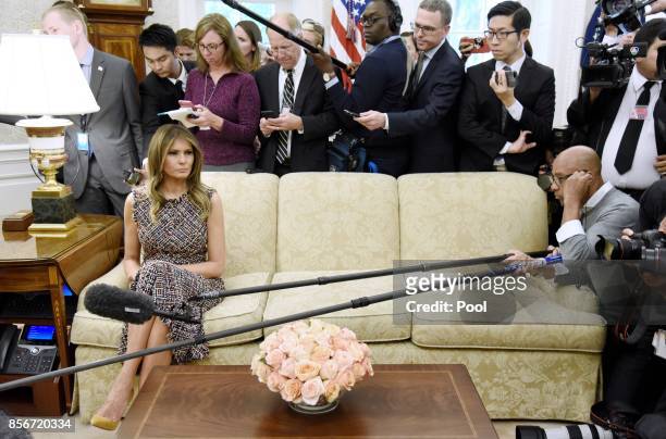 First lady Melania Trump attends a meeting between President Donald Trump and Prime Minister Prayut Chan-o-cha of Thailand in the Oval Office of the...