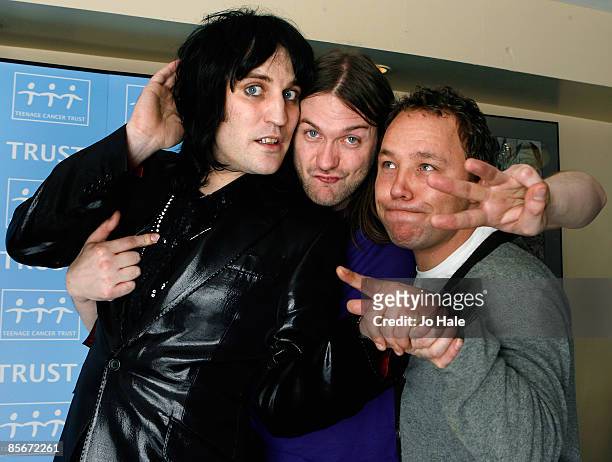 Tom Meighan of Kasabian , comedian Noel Fielding and actor Stephen Graham pose backstage after the fourth night of a series of concerts and events in...